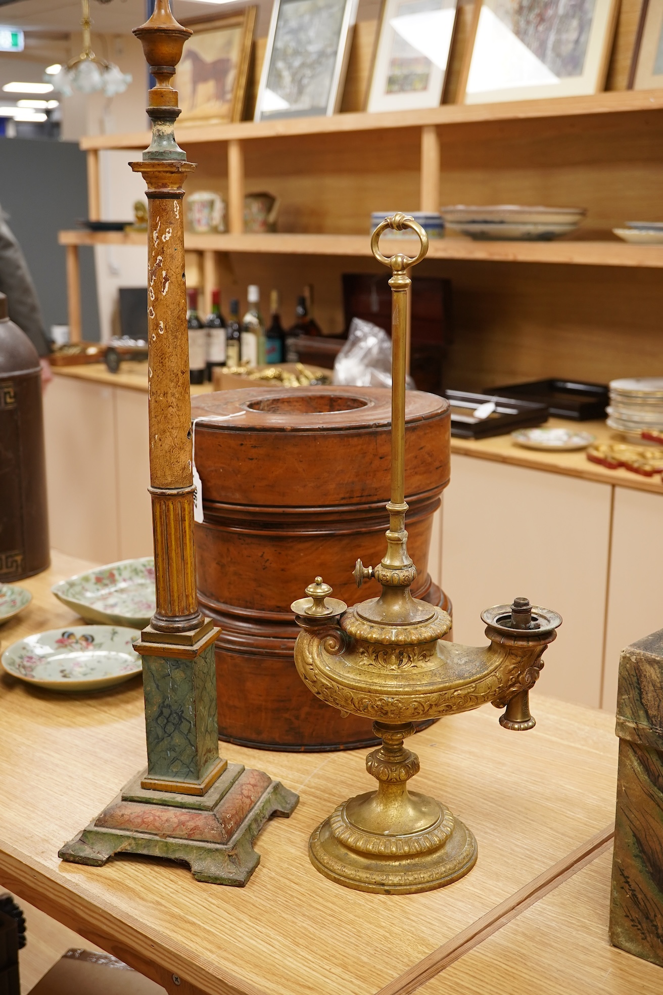 A brass ‘oil lamp’ lamp base and a polychrome painted wood pillar, 75cm